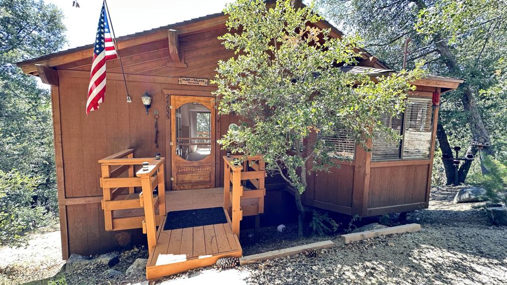 Lost in the woods, at the end of the road, offering dazzling sunsets, this well maintained, cozy cabin provides solitude and seclusion. Open floor plan on the main level; living, dining and kitchen meld into one, surrounding the Malm Imperial Carousal Fireplace. A wall of dual pane windows open to the deck and valley views beyond. The lower level provides 2 Bedrooms separated by a full Bath. The primary bedroom opens to a deck complete with Jacuzzi tub. Storage shed out back for projects. Want to get away? Contact us today.