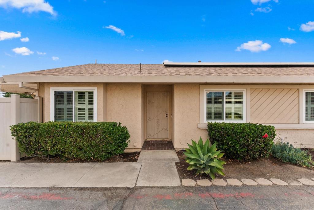 Lovingly maintained detached single-level patio home (PUD) in the community of Countryside in Santee. 2,877 SF corner lot. First time on the market in almost 30 years! 3 bed/2 bath home with dual pane windows, paid-off solar to help save on utility costs (2022), newer roof (2020), 2-car side-by-side attached garage with washer and dryer included. Two sun-filled patio garden outdoor spaces with vinyl fencing. Well-sized living room with fireplace, vaulted ceilings, and slider to patio with pergola. Light and bright kitchen with breakfast nook, tile counters & backsplash, white appliances inc fridge, and pantry that leads to the second slider to enjoy the garden. Primary bedroom with bonus office space that leads to the second patio. En-suite primary bathroom with a walk-in closet, spacious vanity with lots of storage, and a walk-in shower. Third bedroom currently being used as a den. Laminate and tile floors throughout. New ducting & attic insulation (2025). Low HOA of $235/month includes common area maintenance, community pool, playground areas, RV/Boat Storage area (extra fee), and lush grounds. Pet friendly & VA approved complex. Enjoy local trails, Santee Lakes, YMCA Aquatics Center & Sportsplex, Mission Trails Regional Park, and Trolley Square shopping center nearby. Close to public transit, 67 & 52 freeways.