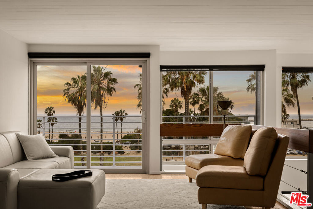 Ocean views abound at 6624 Vista del Mar, a rare architectural sanctuary in Playa del Rey where sculptural form meets the elemental beauty of the coast. Set just moments from the sand, acclaimed dining, coffee shops and nightlife, this luminous residence is a study in thoughtful design, natural materiality, and effortless indoor-outdoor living, all anchored by unobstructed whitewater views from Malibu to Catalina. Every level has been curated with intention, balancing open-plan living and private repose, each space offering a distinct vantage of the sea, sky, and surrounding wetlands. The ground level begins with a two-car garage featuring epoxy floors, built-in storage, and an EV charging station, along with an adjoining workshop complete with utility sink. Inside, a versatile guest suite or media room is grounded by acid-etched concrete floors, a wood-burning fireplace with gas starter, and a full travertine bath. Custom fir doors open to a tranquil rear deck with built-in hot tub, a perfect space for guests or a secluded retreat. The oversized custom oak front door welcomes you to the home. To the west, the primary suite is an elevated coastal refuge, with an ocean-view balcony, walk-in closet, and a spa-caliber bath clad in Porcelanosa tile, featuring a soaking tub, glass-enclosed shower, and serene natural light. Two additional bedrooms, both with built-in closets, enjoy wide wetland views and share a beautifully finished bath with heated floors. At the center of the home, the great room is a luminous expanse beneath vaulted ceilings, where west-facing windows frame endless surf and horizon. The kitchen is understated and refined, with Caesarstone countertops, stainless appliances, and a bar for casual dining. A built-in sidebar adds dimension to the dining area, while the living room opens to a balcony that captures the golden arc of every sunset. Above, a flexible loft crowns the home with sweeping whitewater views from Point Dume to Palos Verdes and a third balcony overlooking the lagoon and coastal path. At the top, a private rooftop deck offers commanding 360-degree vistas, from the Hollywood Sign to Catalina and beyond. With no shared walls, no HOA dues, and a newly installed roof and Ring system, 6624 Vista del Mar offers a singular architectural experience in one of Los Angeles' most quietly spectacular seaside enclaves.