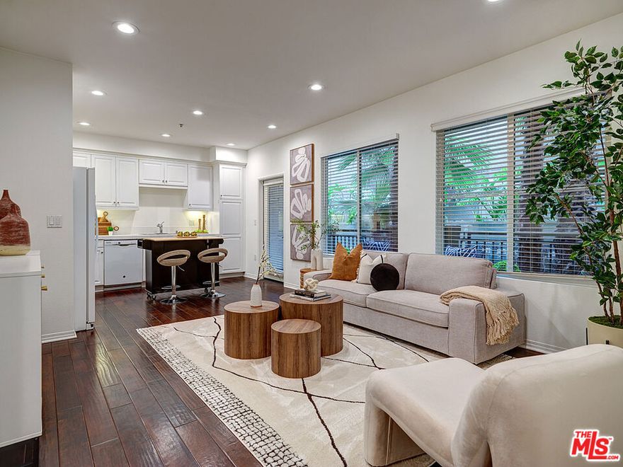 Discover the absolute best opportunity to own a 2-bedroom residence in the highly sought-after Playa Vista community. This single-level, 910 sq ft home in the centrally located Tempo building offers a desirable split-bedroom floorplan and an unbeatable location right across from Concert Park. Step inside to a bright, contemporary open floor plan where the living room and kitchen flow seamlessly together. Rich engineered hardwood floors add warmth and sophistication, while the living room opens to a large private patio with lush green views - perfect for relaxing or entertaining. The spacious primary suite is a comfortable retreat, featuring a roomy walk-in closet and an en-suite bathroom with a large vanity and walk-in shower. The secondary bedroom offers versatile space for a guest room, office, child's room, or flex area. A generous guest bath with tub/shower combination sits conveniently off the hallway. Also in the hallway, you'll find a full-sized stackable washer and dryer. This home includes two parking spaces and grants access to all the incredible Playa Vista amenities: sparkling swimming pools, spas, a state-of-the-art fitness center, parks, sport courts, dog parks, community centers, playgrounds, weekly farmers markets, and more. Just outside your door, enjoy neighborhood favorites like Coffee Bean, Yummy Market, local restaurants, salons, and a dry cleaner - all at your fingertips.