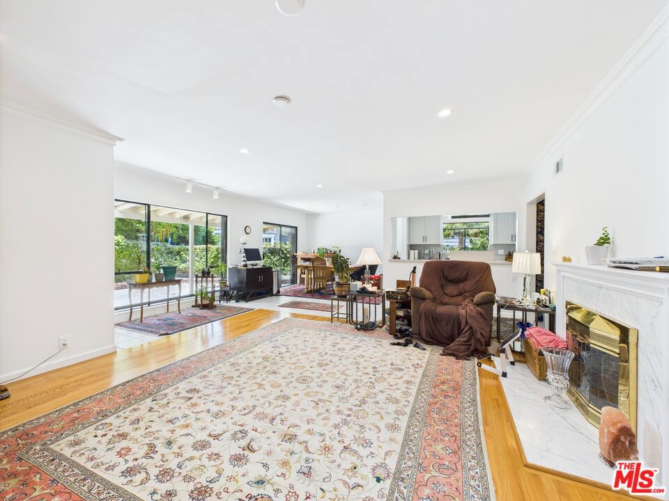 Only available for seller Financing .There's a quiet corner in North Kentwood where homes rarely change hands. Where tree-lined streets feel like a hidden pocket of LA, and neighbors actually wave when they walk their dogs. That's where you'll find 7449 Kentwood Avenue. Behind the gate, past the lush landscaping and mature fruit trees blooming with figs, nectarines, pomegranates, and more, is a home that feels like it's been waiting for the right person to discover it. Maybe that's you. Step inside and you're greeted with sunlight pouring through oversized windows, casting a warm glow across the open living and dining areas. The kitchen is both inviting and functional, with granite counters, stainless appliances, and a breakfast nook that feels like it belongs in a movie. The primary suite is tucked away with its spa-like bath and massive walk-in closet offering the kind of peace and privacy you'd never expect this close to city life. The bonus den is perfect for a creative space, office, or cozy library. But it's the yard that really sets this home apart. That private, spacious, fruit-filled garden isn't just land. It's a lifestyle. It's space to host, to relax, to plant roots and watch them grow. And with seller financing available, this opportunity isn't just special; it's within reach. Homes like this don't last. Schedule your private showing and come feel it for yourself.
