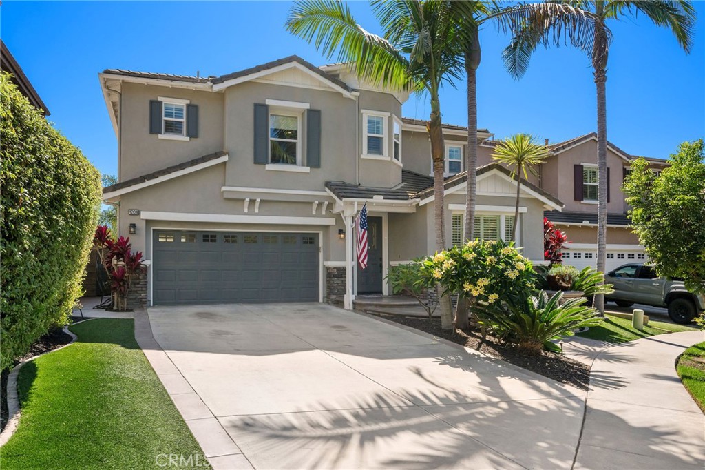 Behind the gates of The Reserve South, this beautifully upgraded home combines timeless design with the relaxed coastal lifestyle San Clemente is known for. Set along a quiet, single-loaded cul-de-sac, the residence welcomes you with impressive curb appeal—stacked stone accents, stamped concrete, and lush landscaping. Inside, recent upgrades enhance every space, from fresh designer paint to wide-plank luxury vinyl flooring that extends throughout the main level. A stacked-stone fireplace with a reclaimed wood mantel serves as the focal point of the living area, while classic shutters bring warmth and character. A flexible downstairs bonus room offers space for an office, playroom, or lounge, while a separate dining room and adjacent butler’s pantry make hosting a breeze. The kitchen is the heart of the home with a large island featuring bar seating and neutral cabinetry that ties the space together. Upstairs, a spacious loft complements three secondary bedrooms, two full bathrooms, and a convenient laundry room with storage cabinets and utility sink. The primary suite is a true retreat, offering a private office nook, spa-inspired bathroom with soaking tub, dual walk-in closets, and gentle ocean views from its elevated vantage point. Step outside to a backyard designed for entertaining, complete with a built-in BBQ, impeccable concrete patio, and vibrant, low-maintenance landscaping. Recent upgrades include whole-house re-piping, solar panels, and new flooring throughout. The home also provides generous parking with a three-car tandem garage, an oversized driveway, and ample street space for guests. The home sits moments away from resort-style amenities, including a pool, spa, clubhouse, and sports field. You’ll also appreciate the convenience of no Mello-Roos and excellent proximity to San Clemente’s schools, beaches, and shopping.