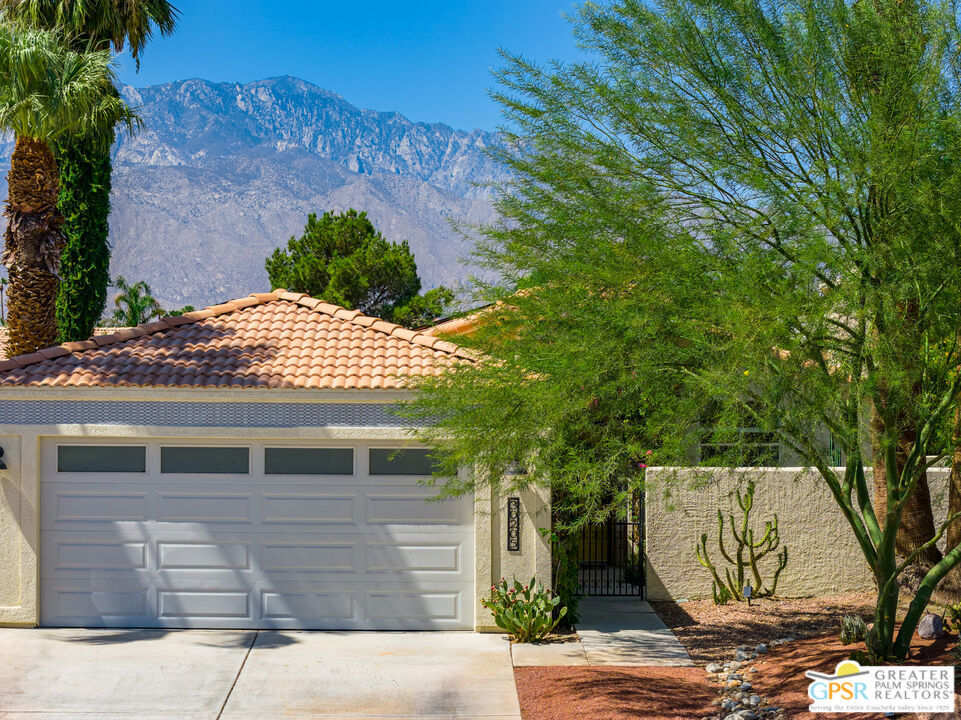 Welcome to this beautifully maintained Cathedral City retreat, a single-level 3 bedroom, 2 bathroom home offers the perfect blend of comfort, efficiency, and style. Vaulted ceilings create an airy, open atmosphere filled with natural light, while the primary suite with en-suite bath provides a private sanctuary with access to a gorgeous glass tile pool and expansive back yard. The versatile den off the living room adds flexibility for a third bedroom, home office, or creative space. Leased solar panels keep energy costs low, and the backyard is a true oasis featuring a sleek lap pool with western mountain views, outdoor kitchen, and lush green space perfect for kids, pets, and entertaining. Indoors, the living spaces connect seamlessly and easily connect indoors to out. Thoughtfully designed for everyday living yet equally suited for hosting, this home balances cozy charm with smart features. Its central location offers easy access to Palm Springs and east valley amenities - from Palm Springs dining and shopping to Rancho Mirage golf and resorts. Whether you're looking for a full-time residence or a seasonal escape this home offers it all at a fabulous price.