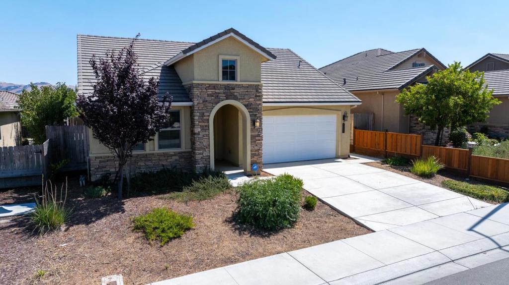 Back on the market at no fault to seller! Welcome to the beautifully maintained 3-bedroom, 2-bathroom home in the desirable Santana Ranch community of Hollister. Open-concept living and dining areas with tile flooring and abundant natural light. The kitchen features granite countertops, Bosch stainless steel appliances, a large island, and soft-close cabinetry. Spacious primary suite offers a walk-in closet and private ensuite. Two additional bedrooms and a second full bathroom provide comfort for family or guests. Enjoy outdoor living on a large backyard patio with an arbor. Other highlights include central A/C, ceiling fans, double-pane windows, and a 2-car garage. Located at the end of a cul-de-sac for added privacy, close to parks, shopping, and schools. Move-in ready and perfect for modern living.