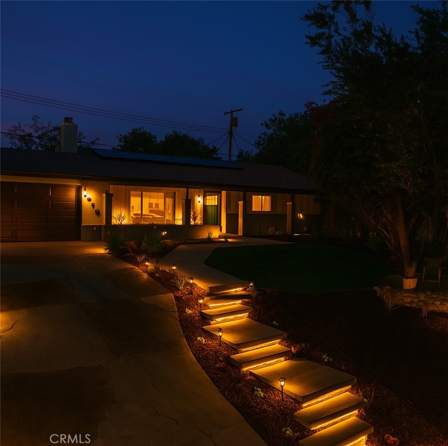 *See Our 360 Degree Virtual Tour* Modern Ranch-Style Beauty in North Corona-Welcome to this stunning, fully renovated near 2,500 sq ft single-story modern ranch-style home nestled on a spacious 0.27-acre lot in desirable North Corona. Featuring 3 bedrooms, 2 bathrooms, and a bonus den, this home blends contemporary upgrades with timeless charm. Step inside to a bright open floor plan showcasing a brand-new gourmet kitchen complete with a center island, gleaming quartz countertops, ranch-style sink, sleek black fixtures, and ample storage. The heart of the home flows seamlessly into the family room, highlighted by a custom fireplace perfect for relaxing or entertaining. The luxurious master suite offers a peaceful retreat with a spa-inspired bath featuring an exotic porcelain walk-in shower with glass enclosure, dual sinks, and a massive walk-in closet. Manufactured hardwood floors run throughout the home, complemented by crisp white paint, new interior doors accented by custom black door handles and hinges. Throughout the home there are recessed LED lighting, and ceiling fans. Additional upgrades include a brand-new HVAC system with new condenser and ducting, dual solar systems with Tesla backup batteries (leased), and energy-efficient new windows. The exterior boasts fresh paint, custom landscaping, and a long driveway with RV parking, complete with dedicated power and water hookups. Situated close to shopping, dining, and with easy access to both the 15 and 91 freeways, this turnkey home offers comfort, efficiency, and style—all on a private and spacious lot with the added bonus of a low tax rate!
