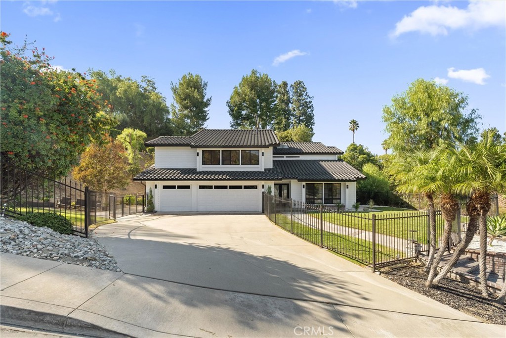 **MODERN AND SPACIOUS HOME WITH AN UPSTAIRS ENTERTAINMENT AREA, DOWNSTAIRS BEDROOM $ FULL BATHROOM**Tucked into the esteemed South Hills neighborhood of West Covina, this 4-bedroom, 3-bathroom residence offers 3,632 square feet of recently renovated living that rivals new construction. Set on a generous 0.59-acre lot (approximately 25,709 square feet), the property provides flexibility for adding a casita, ADU, or custom living quarters, perfect for extended family or supplemental income. Enter through a double door into a welcoming foyer with high ceilings and a graceful staircase, where a downstairs bedroom and bathroom ensure privacy for extended households. Notable upgrades include a whole-house water filtration system for pristine water, new flooring across every spacious room, electrical outlets enhanced with USB ports, dual new air conditioning units for both levels, and a skylight that brightens the interior. A bay window in the family room enhances natural light and frames a pleasant view, while the kitchen impresses with bright stone countertops, a sleek oversized waterfall island, and harmonized cabinets and appliances—ideal for culinary creativity. All bedrooms are generously sized, offering a comfortable retreat after a long day. The exterior shines with a backyard featuring a new irrigation system with sprinklers, a balconied deck for relaxation, and an outdoor kitchen complete with a BBQ, island, and sink—perfect for evening gatherings under the stars. This well-maintained yard enhances the home’s appeal as a private oasis. South Hills delivers a tranquil suburban lifestyle, supported by the highly regarded West Covina Unified School District, including South Hills High School, noted for its robust college prep curriculum. Nearby, Gingrich Park and the West Covina Sportsplex offer green spaces and amenities like a public golf course. South Hills Plaza is conveniently close, with Tokyo Central for groceries and Lan Noodle for dining. The I-10 provides seamless access, placing downtown Los Angeles 20 miles west, Disneyland Resort 25 miles south, and Angeles National Forest trails 15 miles away. This home is highly impressive so elevate your lifestyle by making your dreams come true