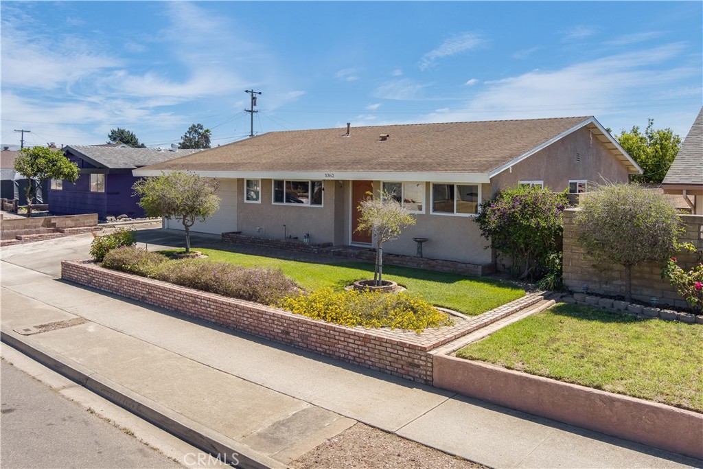 Appealing Mission Hills Single-Story Home -Welcome to this beautifully maintained home in the highly desirable Mission Hills neighborhood of Lompoc. From the moment you arrive, you’ll be impressed by the inviting curb appeal featuring a brick wall, planters, and an extended paved driveway. Step inside to a bright and spacious living room that flows seamlessly into the dining area and kitchen. The cheerful eat-in kitchen offers abundant cabinetry, a ceiling fan, and a picture-perfect view of the manicured front yard. A built-in hutch and decorative shelving add both style and functionality. The kitchen opens to an expansive second living room—ideal for gatherings—complete with a ceiling fan and sliding glass doors that lead to the backyard retreat. The primary suite is a true haven, featuring a recently updated en-suite with designer subway tile, a modern vanity, and sleek fixtures. Two additional spacious bedrooms share a beautifully updated bathroom with contemporary finishes. Step outside to an entertainer’s dream backyard, fully fenced with block walls for privacy. Enjoy lush green grass, a large patio, surrounding planters, and a spacious patio perfect for morning coffee at sunrise or unwinding at sunset. Additional highlights include: Newer Milgard dual-pane windows, Newer central heating system, Storage shed in side yard. This turnkey home offers the perfect blend of comfort, style, and functionality—all in a sought-after neighborhood. Don’t miss the opportunity to make it yours!
