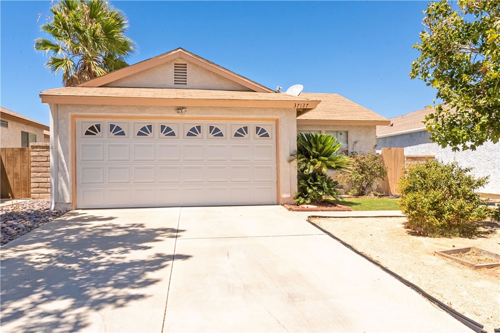 Perfect Starter Home! This charming home is move-in ready with new flooring throughout and a newer A/C system to keep you comfortable year-round. The low-maintenance front yard features beautiful turf and decomposed granite, giving great curb appeal with minimal upkeep. Step into the backyard, complete with a covered patio ideal for relaxing or hosting guests. You'll also appreciate the new garage door opener with a backup battery, ensuring convenience and security. Inside, enjoy new ceiling fans and updated lighting fixtures. This home has everything you need to settle in and make it your own.