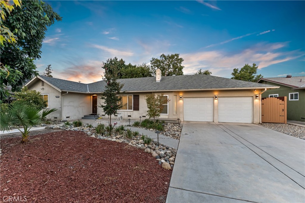 Welcome to your dream home that boasts 3 bedrooms and 2 baths, making it the perfect sanctuary for you and your family. As you step inside, you're greeted by an inviting living room adorned with a charming fireplace and a large window that floods the space with natural light. The kitchen is a chef's delight, boasting newer cabinets, stunning granite countertops, and sleek stainless steel appliances that blend style with functionality. Retreat to the master bedroom, where a striking brick fireplace adds character and warmth. With patio slider doors leading straight into your expansive backyard oasis, you'll find it easy to unwind or host gatherings under the sun. Don't miss out on this incredible opportunity to make this house your home! Schedule your private showing today and envision your future in this captivating space!
