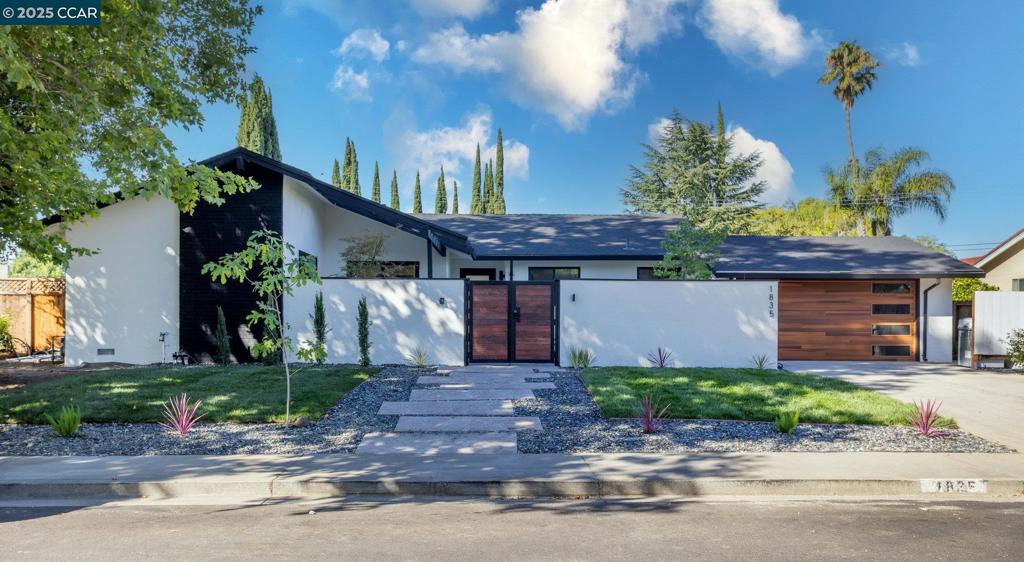 **OPEN HOUSE SATURDAY & SUNDAY 11am -4pm** A true gem in Walnut Creek, this completely renovated 4-bedroom, 2-bath home in Carriage Square redefines luxury and modern living. With impeccable high-end finishes throughout, the open-concept layout seamlessly blends sophistication and functionality. The chef’s kitchen, high ceilings, and abundant natural light create an inviting atmosphere, while 3 bifold doors open to an expansive outdoor space perfect for entertaining, featuring a pool and plenty of room to relax and unwind. Set on a large lot with a beautifully landscaped front courtyard, this home offers privacy and style. Located just minutes from De La Salle High School, Trader Joe’s, Whole Foods, and easy freeway access, it’s a rare opportunity in one of Walnut Creek’s most desirable neighborhoods. A true masterpiece with exceptional curb appeal and a flawless design.