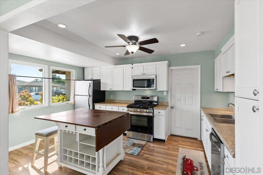 This exceptionally maintained 2bed, 1bath in the heart of College Grove/Rolando Park offers 1,155 sq ft of bright, clean, and thoughtfully updated living space. You’ll instantly notice the abundance of natural light, large space and move-in ready updates that include a newer roof and upgraded plumbing. Outside is truly a private backyard oasis. Sitting .34 aces, fully fenced, canyon lot, with an expansive terrace and incredible panoramic views. Whether you're relaxing in the quiet beauty of nature, entertaining guests, or planning for a future ADU, this outdoor space offers endless possibilities. The detached bonus room adds even more flexibility — perfect for a home office, guest suite, creative studio, or extra entertainment space. In addition, enjoy plenty of additional storage and a convenient oversized 1-car garage. Tucked away in a peaceful neighborhood yet just minutes from shopping, SDSU, and major freeways, this home truly offers the best of both worlds: privacy, space, and location. If you’ve been searching for a move-in ready home with charm, views, and room to grow — this is it.