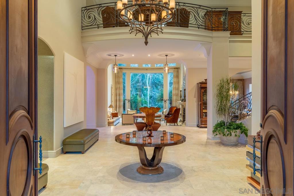 A private oasis tucked within the exclusive, guard-gated estates of Fairbanks Ranch—a community known for its world-class equestrian facilities and pristine amenities amid 75 acres of park-like grounds—this stunning updated Spanish-Mediterranean-style home epitomizes luxury living. Architectural details abound, from a dramatic curved central staircase to arched doorways and soaring double-height ceilings, alongside high-end finishes, fixtures and European detailing. Host in the formal living or dining rooms, serve from a spacious chef's kitchen or entertain in the family room—which includes a corner wet bar—and seamlessly spills open into a patio with a BBQ, pool, spa and a lushly landscaped backyard crisscrossed with paths. There’s space for every need, like a library/large home office, gym, even a personal indoor golf simulator. And at night, retreat to a primary suite with an enviable dressing room/bathroom that includes a double shower and luxe soaking tub that's simply dreamy. Complex Features: ,,,,,, Equipment: Fire Sprinklers,Garage Door Opener,Pool/Spa/Equipment, Range/Oven, Washer Sewer: Sewer Connected, Public Sewer Topography: RSLP,GSL Frontage: Open Space