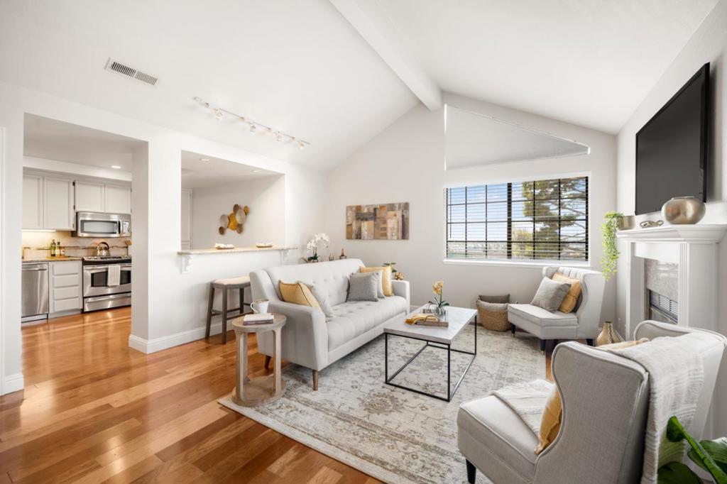 Welcome to this move-in-ready home in the Communication Hill area. The views & privacy of this end-unit make this home a retreat. This residence features 2 bedrooms & 2 full bathrooms, offering a comfortable living space of 1,099 square feet. Notice the large patio overlooking the nature preserve and neighborhood. It extends your living space & makes a great place to entertain. The kitchen is well-equipped with granite countertops, a dishwasher, garbage disposal, microwave, self-cleaning oven, & refrigerator, making it the heart of the home for culinary enthusiasts. Enjoy the open layout with a dining area in the living room, accentuated by the warm glow of a fireplace & the elegance of wood flooring throughout. The home also boasts central AC & heating, ensuring a pleasant environment year-round, & a vaulted ceiling that adds to the spacious feel. The large primary suite features a sliding glass door leading out to a private balcony. The primary bathroom features a tub and shower combo & an expansive counter. Laundry is conveniently located inside, equipped with a washer & dryer, streamlining household chores. This property has garage space for one vehicle, plus an assigned parking space. This home is perfect for a cozy & manageable lifestyle in the heart of San Jose.