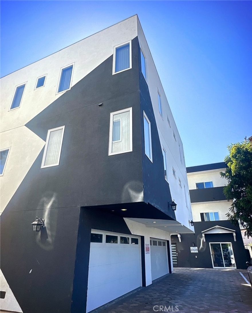 Welcome to this stunning and modern tri-level townhouse located at 1735 1/2 Magnolia Avenue in the heart of Los Angeles. This newer construction offers 1,382 square feet of thoughtfully designed living space within a private, gated six-unit complex. With three spacious bedrooms and three bathrooms, each bedroom provides its own private entrance, a luxurious en-suite bathroom, and a generous walk-in closet, making this home ideal for comfortable and convenient living.



Natural light fills every corner of the home, accentuating the sleek laminate flooring and recessed lighting throughout. The contemporary kitchen is a chef’s dream, featuring a large island for entertaining or meal prep, and equipped with high-end appliances, including a dishwasher, stove, refrigerator, and microwave—all included. Additional features like central heating and air conditioning, in-unit laundry, and modern finishes throughout ensure you’ll live in both comfort and style.



Situated in the bustling neighborhood of Pico-Union, this property offers unmatched access to the best of Los Angeles. Enjoy nearby landmarks like LA Live, the Crypto.com Arena, and the Los Angeles Convention Center, all just minutes away. For those who appreciate history and culture, MacArthur Park and the Wilshire Boulevard Corridor are within close proximity, offering a mix of green space and architectural charm. Food lovers will delight in the diverse dining options nearby, from local taco spots to fine international cuisine. With convenient access to major freeways like the 10 and 110, as well as public transportation options including Metro lines, commuting to Downtown LA, USC, and beyond is a breeze.



This modern townhouse offers not just a home, but a vibrant lifestyle in one of LA’s most dynamic neighborhoods. Don’t miss out—schedule your tour today!