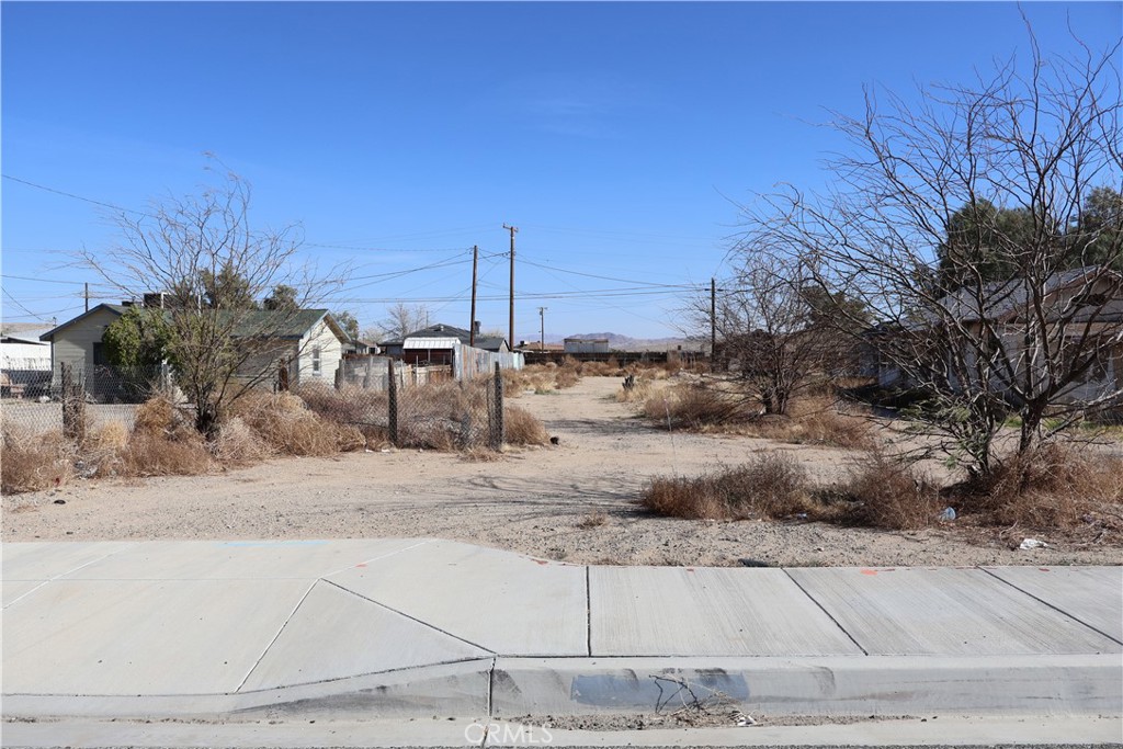 Great opportunity in Barstow, California! Be the owner of this commercial land located on W Main St, across the way from the Barstow International Gateway, BNSF Train Hub. Awesome location with constant traffic. The Barstow International Gateway will be an approximately 4,500-acre new integrated rail facility on the west side of Barstow, consisting of a rail yard, intermodal facility and warehouses for transloading freight from international containers to domestic containers. The new facility will bring thousands of direct jobs to California’s high desert communities, reduce highway and port congestion, and maximize rail and distribution efficiency regionally and across the U.S. supply chain. CR (Rural Commercial) land use zoning district provides sites for retail trade and personal services, repair services, lodging services, recreation and entertainment services, transportation services, and similar and compatible uses. Agriculture and residential uses allowed also but are secondary in importance. Commercial land at this price you cannot beat!