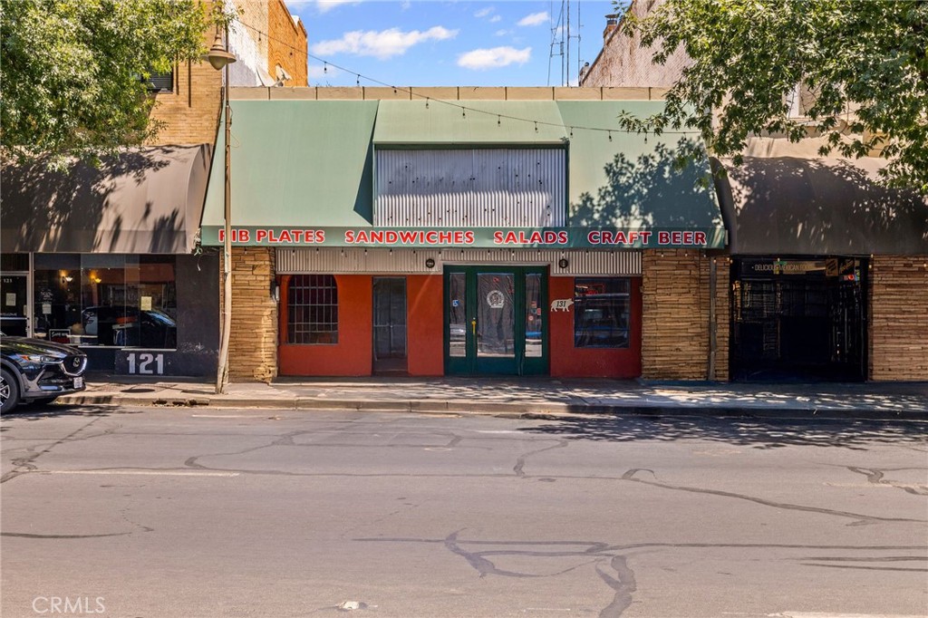 Located in the core of Downtown Chico between 1st and 2nd Streets, just a half block from California State University, Chico, this mid-size restaurant building with basement offers a rare opportunity for an operator or investor to own affordable real estate in one of the most vibrant and high-traffic blocks in the city. Formerly home to Smokin’ Mo’s BBQ for over 20 years—and with a legacy of successful restaurant operations spanning decades—131 Broadway boasts both charm and proven performance.
The ±2,640 SF main level features a spacious dining area with tall ceilings, exposed original brick walls, rustic hardwood flooring, and abundant natural light from skylights. The open kitchen includes a 12-foot hood with Ansul fire suppression system, prep area, walk-up cashier’s counter, and self-serve beverage station. Guests can also enjoy the large rear patio—approximately 1,700 SF—with plenty of room to expand the outdoor dining experience.
The ±1,800 SF basement offers excellent utility and functionality with an employee locker area, office area, mechanical room, storage space, walk-in refrigerator, sidewalk hatch for deliveries, and easy utility modification.
Key Features:
-Prime Downtown location just steps from CSUC
-Clear span construction with flexible layout
-Outdoor patio with expansion potential
-Iconic building with long-standing restaurant history
-Surrounded by Chico’s most popular restaurants, bars, and shops
-High pedestrian and vehicle traffic