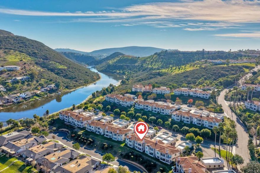 This turnkey condo in the Panorama community at Lake San Marcos is a true standout. Thoughtfully refreshed throughout, the home features new flooring, updated windows, and beautifully remodeled bathrooms, creating a light and modern living environment. Enjoy partial lake views and stunning sunrise skies, along with a location that’s perfectly positioned—far enough down the hill to be walkable to Amalfi Enoteca and other Lakehouse Resort amenities. Panorama HOA owners also enjoy discounts at the resort. The community offers scenic trails for walking, biking, and hiking, along with a well-maintained pool and clubhouse. A short golf cart ride takes you to St. Mark’s Executive Golf Course, recently redesigned and updated. Set in the highly desirable San Marcos climate this home offers comfort, convenience, and an exceptional lifestyle in one of North County’s most attractive lake communities. HOA covers water and garbage.