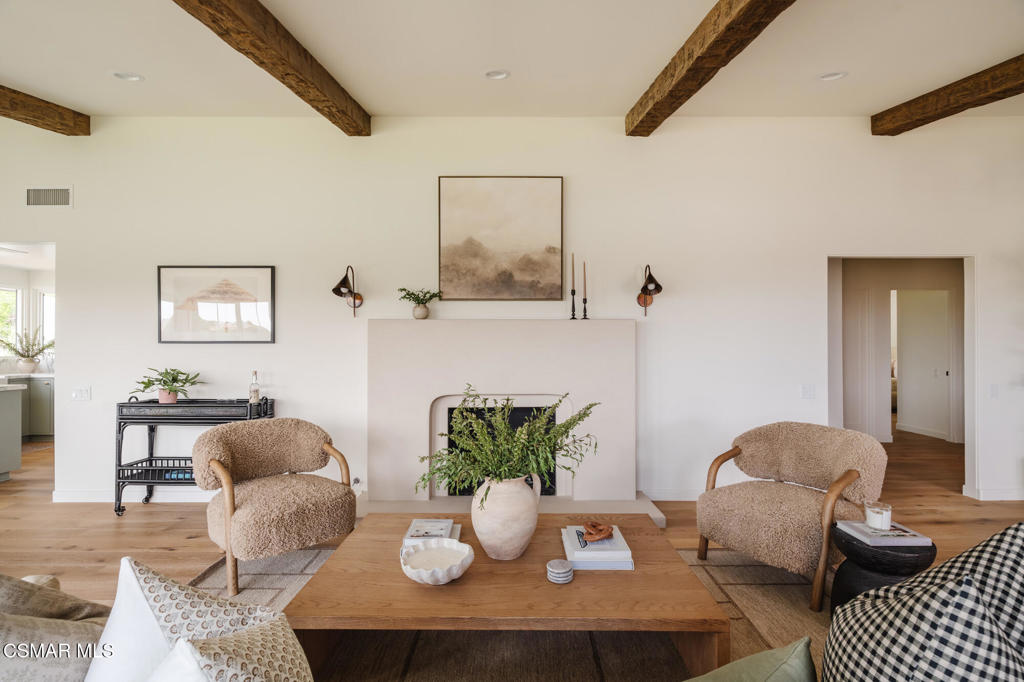 Spanish-Inspired Stunner with Ocean Views & Designer Finishes. Discover this stunning Spanish-style single-story showplace in Ventura's coveted Clearpoint community. Perched on a premium corner lot at the top of a cul-de-sac, this fully remodeled 3-bed, 3.5-bath home pairs ocean, mountain, and sunset views with high-end, designer-level finishes throughout. Step through a custom Pinky's Iron double-door entry into airy interiors featuring wide-plank French oak floors, vaulted ceilings, and walls of glass for seamless indoor-outdoor living. The open-concept layout flows from a fireplace-lit living room to a formal dining area and cozy family room. At the heart of this home is a gourmet kitchen with Arabescato Corchia marble counters, flanked by unlaquered brass faucets, hardware and ocean views. Here you will find full custom cabinetry with a rich green tone that blends the warm hues of brass and French oak beautifully. New appliances throughout are waiting for your arrival French doors off the breakfast nook open to a beautifully landscaped backyard retreat. The spacious primary suite offers direct access to the outdoors and a spa-like bath with Zellige tile, a soaking tub, a custom iron shower enclosure, and a walk-in closet. Two additional bedrooms and stylish bathrooms, including a powder room, provide comfort and privacy. The expansive backyard is built for entertaining, with dining area, lounge area, new grass and sprinkler systems, flagstone paths, fruit trees, views, and room for a future pool or ADU. Additional upgrades include: windows/doors, HVAC, electrical, plumbing, water heater, washer/dryer, new roof, epoxy-finished garage, designer lighting, new stucco, and more. This home blends luxury, style, and the best of California living--schedule your private tour today!