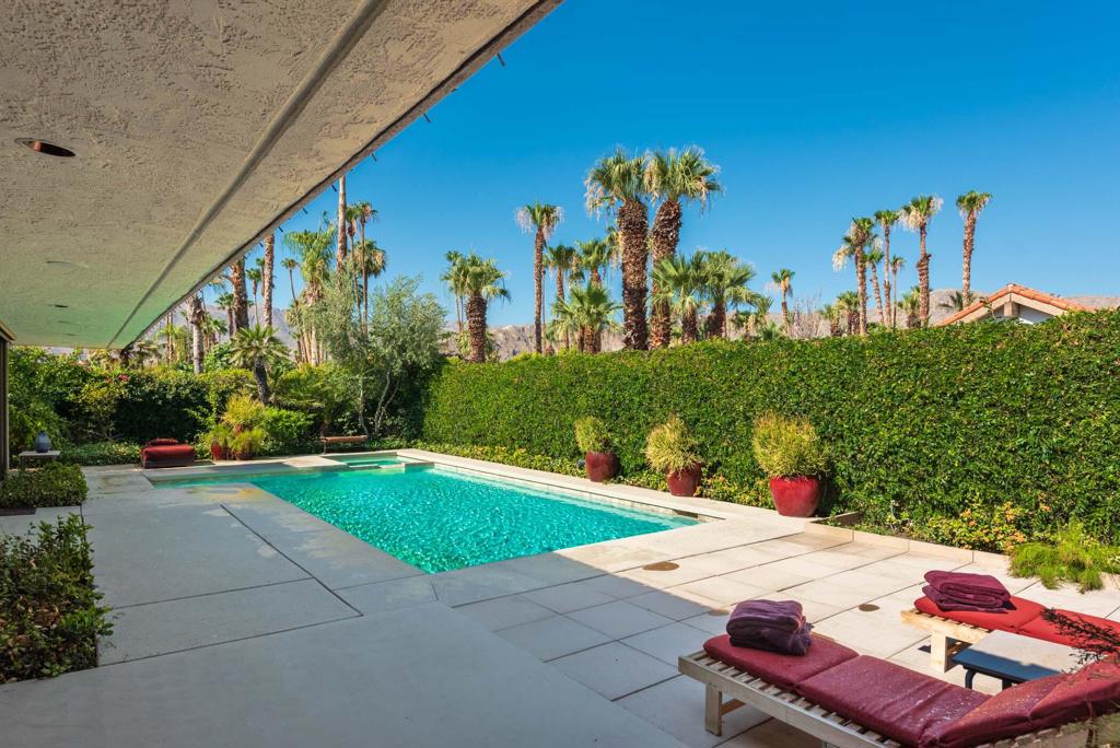 *LEASED OCT 2025 AND JAN-APR 2026* This completely remodeled 3 bedroom/3 bathroom home is a unique free-standing property is completely private and secure. The lush, semitropical landscape allows for a calming verdant environment. The west facing mountain views allow for glorious sunsets are nightly. A commercial grade, high pressure misting system surrounds the outdoor living area, ensuring comfort on hot days. The house also includes a state-of-the-art sound system throughout the indoor and outdoor entertainment areas. The house interior includes raised ceilings, distinctive large skylights and designer lighting throughout the interior and landscaped exterior. The decor is distinguished with colorful accents, original artwork and unique antiques throughout the home. The home provides vast entertaining areas including an entry foyer, large living and dining rooms, a separate kitchen dining area, and family room, an open kitchen and a kitchen bar accommodating six persons. A additional full-service bar is located adjacent to the entertainment areas. There are two secluded principal bedrooms including walk-in closets, completely renovated bathrooms and in-room bar refrigerators. A third bedroom is multi-purposed as an office, or guest room. A state of-the art sound system provides for smart and seamless entertainment, indoor and outdoor. A two car plus golf cart garage provides for plenty of parking. Come enjoy the full amenities and security provided by The Springs CC.