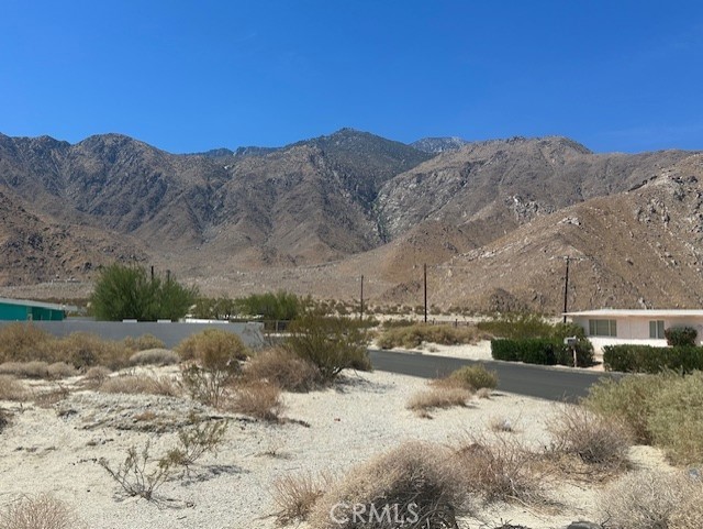 * * * E X C E L L E N T * * * O P P O R T U N I T Y * * * For Owner-Builder or Developer. Large Flat Lot for sale in an upcoming neighborhood just minutes from downtown Palm Springs with GREAT MOUNTAIN VIEWS. On a paved street with utilities nearby. This is unincorporated area of Riverside County which is more flexible on short term vacation rentals. I also have the neighboring lot for sale.