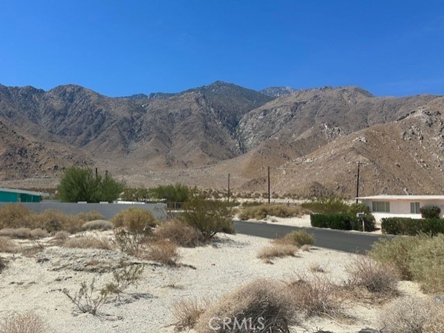 * * * E X C E L L E N T * * * O P P O R T U N I T Y * * * For Owner-Builder or Developer. Large Flat Lot for sale in an upcoming neighborhood just minutes from downtown Palm Springs with GREAT MOUNTAIN VIEWS. On a paved street with utilities nearby. This is unincorporated area of Riverside County which is more flexible on short term vacation rentals. I also have the neighboring lot for sale.