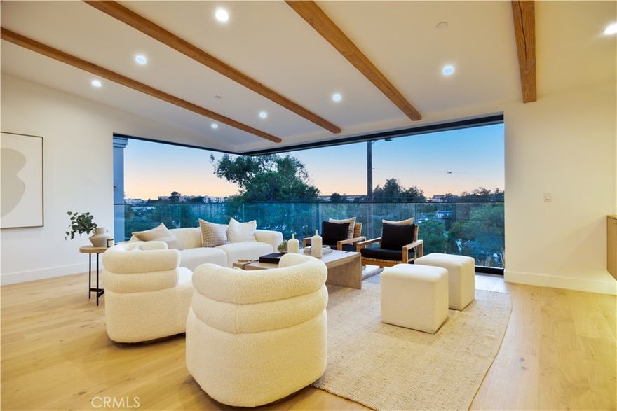 Brought to you by Pacific Design Build, whose team has been featured in Architectural Digest, CA Home & Design, Domain Home and Open House on NBC. This brand-new, custom-built, modern coastal retreat blends refined design with exceptional craftsmanship. Spanning nearly 4,000 square feet, this thoughtfully curated home is just a short stroll from the greenbelt, Valley Park, and the vibrant energy of Pier Avenue. Step into a light-filled sanctuary where expansive open-concept living meets modern sophistication. A stunning 28-foot wall-to-wall sliding glass door seamlessly connects the interior to the outdoors, framing serene views of the greenbelt and Hermosa Valley. The chef’s kitchen is a standout centerpiece, featuring a 48-inch Wolf gas range with dual ovens, Sub-Zero side-by-side refrigerator/freezer, and a beautiful 10-foot marble island. Retreat to the spa-inspired primary suite, where a freestanding soaking tub and oversized rain shower create a true sanctuary. A 12-foot slider and french doors open to a private outdoor escape, blending indoor comfort with serene exterior living. Each bathroom is thoughtfully finished with premium fixtures and designer details for a cohesive, elevated experience. A spacious deck off the top level is perfect for grilling and chilling, while the rear patio offers a cozy outdoor lounge and lush landscaping—ideal for entertaining or unwinding in style. Additional highlights include an EV-ready garage, solar panels and carefully selected finishes that balance functionality with luxury. With thoughtful design throughout and premium appliances in every corner, this home is a true coastal masterpiece—crafted for comfort, style, and effortless California living. WHEN YOU BUY HERE, YOU’RE BUYING A LIFESTYLE.