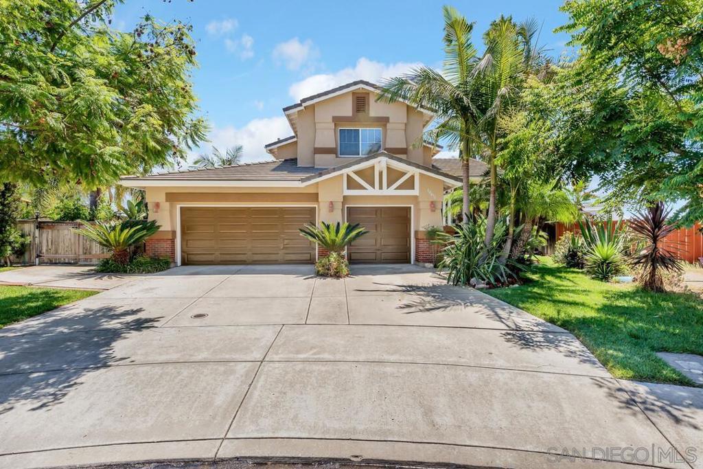 Move-in ready home perfectly situated at the end of a quiet cul-de-sac with no through traffic. Soaring windows fill the interior with natural light, highlighting the spacious layout that includes a front family room, a separate living room, a formal dining area and a large open kitchen with a walk-in pantry. The expansive primary suite offers a huge walk-in closet and a private balcony where you can take in breathtaking mountain views. Additional features include two AC units and an attached three-car garage. The backyard is truly exceptional. Set on a half-acre lot, it boasts an inground solar-powered pool, a built-in BBQ with an outdoor kitchen, a bocce ball court, and more. Surrounded by incredible tropical trees, lush landscaping, and panoramic mountain views, this private retreat is an entertainer’s paradise. Conveniently located near Santee Town Center, Santee Lakes, Mission Trails, and with easy access to the 52 and 67 freeways. This is a must see!
