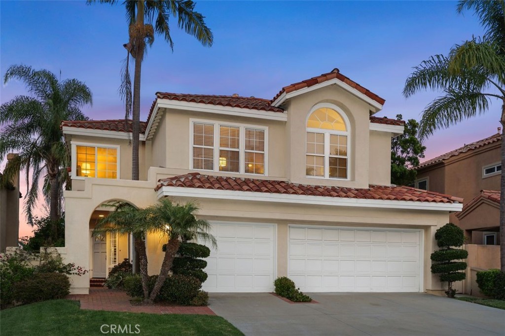 PANORAMIC OCEAN, MOUNTAIN & CITY LIGHT VIEWS | RARE OPPORTUNITY IN NIGUEL SUMMIT
Set on a desirable single-loaded cul-de-sac in the prestigious Niguel Summit community, this beautifully refreshed Paragon home offers unobstructed views of the ocean, surrounding hillsides, and sparkling city lights. Ideally located in a family-friendly neighborhood near world-class beaches, resorts, and top-rated schools, this is coastal Southern California living at its finest.Spanning approximately 3,400 square feet, the flexible floor plan includes 4 bedrooms, 3 full bathrooms, and an expansive upstairs bonus/media room. A private gated courtyard welcomes you into a light-filled interior featuring luxury vinyl flooring, new carpet, and soaring vaulted ceilings. The oversized chef’s kitchen, complete with generous counter space and dining area, flows seamlessly into the spacious family room with cozy fireplace — all opening to a backyard designed for entertaining.The main level includes a versatile office or 4th bedroom with a full bath, perfect for guests or remote work. Upstairs, the expansive primary suite features a spa-inspired bathroom, walk-in closet, and a private balcony that captures breathtaking sunset views. Secondary bedrooms are spacious, with one large enough to function as a game room, theater, or home gym.Enjoy endless outdoor living in the backyard oasis — complete with panoramic vistas and space for dining, lounging, or adding a pool.Just minutes to the Waldorf Astoria, Ritz-Carlton, Dana Point Harbor, Salt Creek Beach, hiking trails, and Laguna Beach’s famed art and culinary scene.Homes like this rarely come to market. Don't miss your chance to live in one of the most sought-after locations in Laguna Niguel.