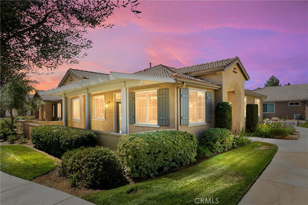 Located in the gated 55+ senior community of Four Seasons. This beautiful Springdale 2 model has been recently updated with over $65,000 in improvements. Those upgrades include: High end wood flooring throughout the home, new wide base moldings, new plantation shutters, new flush lighting, new ceiling fans and new stainless steel appliances. There was a total master bathroom remodel with designer shower and floor tile, quartz counter top, new toilet, removal of a wall, new mirrors and new heavy duty shower door. The secondary bathroom has new tile floors. There has been a new Alumawood patio cover added to the rear patio. The Four Seasons resort community includes a lodge with a resort style pool complex with cabanas and jacuzzi, grand ballroom, bistro, 50 seat movie theater, billiards room, full service salon, bocce ball courts, 4 tennis courts, 8 pickle ball courts, 9 hole putting green, horseshoe court, shuffle board courts, basketball courts, 2 large fitness centers, six miles of walking trails, indoor pool complex and dog park. SELLER FINANCING AVAILABLE WITH INTREST RATE AT 5% WITH 20% DOWN AND GOOD CREDIT.