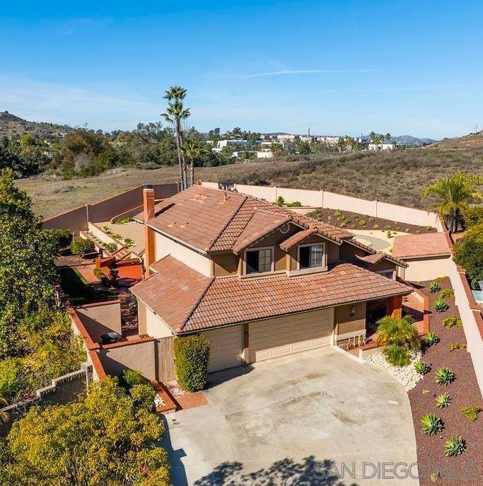 Nestled in a serene cul-de-sac, this charming family home offers 4 bedrooms and 3 full baths, with one bedroom and bath conveniently located downstairs. The property spans on nearly half an acre of fully usable, fenced land with decorative block walls stucco to match the home. The entertainers backyard is landscaped with drought-resistant plants, sprinklers and a lovely waterfall. The home boasts over 2271 square feet of living space, which has been tastefully updated in the last two years, The step down living room was been leveled to create a seamless flow on the first floor. Newly renovated kitchen features new cabinets, stainless steel appliances, quartz counter tops, canned lighting and a convenient pot filler over the cook top. New sliding glass door added at dining room. Family room showcases a cozy fireplace and newly added French doors with picturesque views of the back country and sunsets .Bamboo Wood Floorings through out with a custom staircase of tile and bamboo. Upstairs spacious primary bedroom includes soaking tub, separate shower, dual sinks and large walk in closet. Two additional bedrooms and a full bath complete the 2nd floor. Stunning sunset and back country vistas. Additional home features a 23x11 workshop/hobby room perfect as a man cave or a She shed plus a large3 car garage. New Solar panel system with two batteries. Freshly painted interior, new baseboards. Situated in a friendly neighborhood with plenty of room for a pool and other recreational vehicles. This is not a flip, sellers intended stay and made tasteful updates to the home.