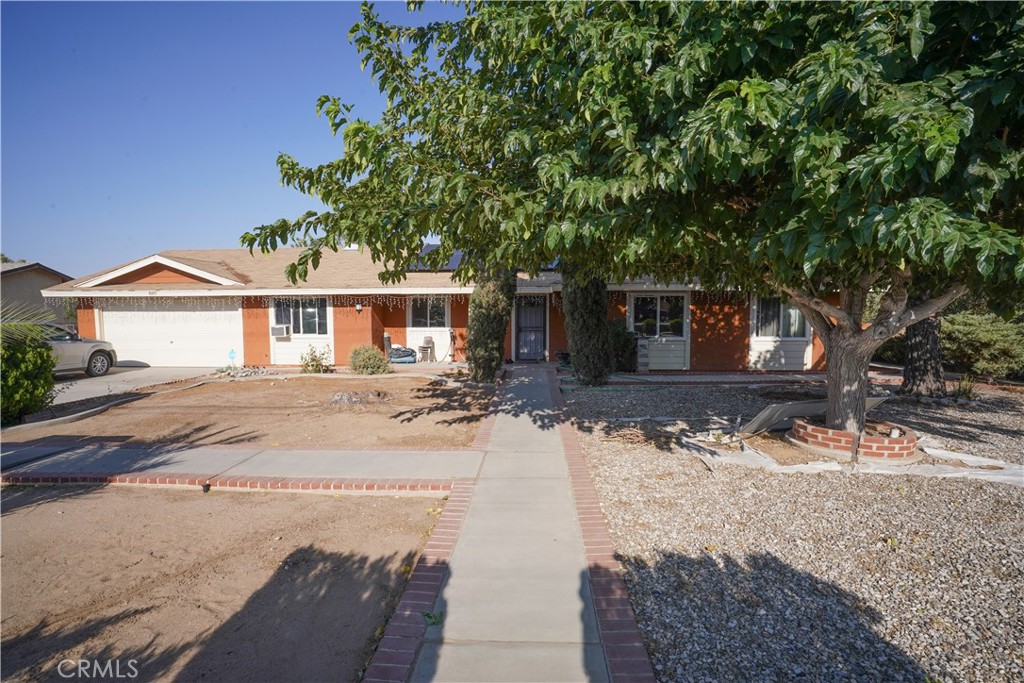 Location!! Land!! This house has it all! Sitting on a little under half an acre lot, this 3 bed 2 bath home w/bonus bedroom is conveniently located close to schools, gas stations, and shopping centers. The spacious back yard has many fruit trees as well as chicken coups and a small storage shed. The front yard has low maintenance landscaping and mature trees giving perfect shade for hot summer days. With a little TLC this can make the perfect home for first time home buyers or a growing family. The home features dual pane windows, fireplace, granite kitchen countertops, indoor laundry, and a covered patio.