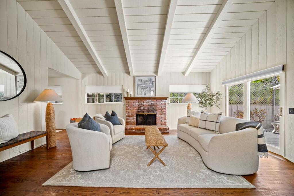 Located in Carmel, this enchanting home offers the perfect blend of comfort, character, and convenience, situated within close proximity to all that Carmel-by-the-Sea and the Monterey Peninsula have to offer. A stained-glass accented entry sets a welcoming tone, opening to a naturally lit living room with open beam ceilings, a classic brick fireplace, and hardwood floors that add timeless charm. The primary ensuite bedroom provides a private retreat with sliding doors that lead directly to the back deck, creating a seamless connection to the outdoor is ideal for morning coffee, afternoon relaxation, or evening gatherings. This charming home captures the essence of Carmel living while being just minutes from renowned galleries, award-winning restaurants, boutique shops, and the areas breathtaking coastline.