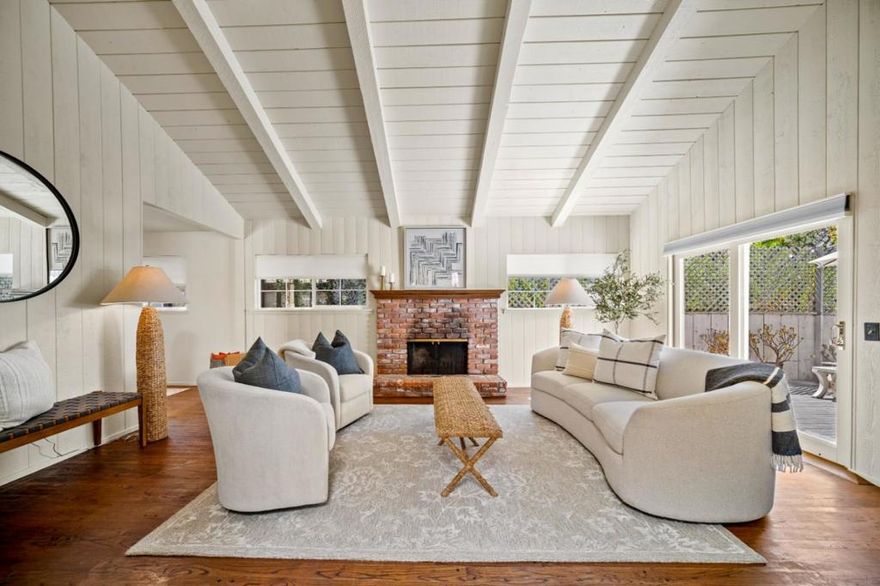 Located in Carmel, this enchanting home offers the perfect blend of comfort, character, and convenience, situated within close proximity to all that Carmel-by-the-Sea and the Monterey Peninsula have to offer. A stained-glass accented entry sets a welcoming tone, opening to a naturally lit living room with open beam ceilings, a classic brick fireplace, and hardwood floors that add timeless charm. The primary ensuite bedroom provides a private retreat with sliding doors that lead directly to the back deck, creating a seamless connection to the outdoor is ideal for morning coffee, afternoon relaxation, or evening gatherings. This charming home captures the essence of Carmel living while being just minutes from renowned galleries, award-winning restaurants, boutique shops, and the areas breathtaking coastline.
