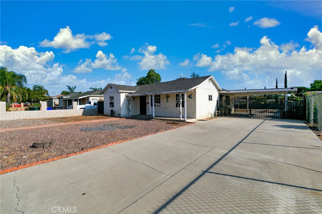Welcome to this charming single-family home in a desirable Fontana neighborhood, just steps from a local elementary school! This inviting residence offers 2 bedrooms and 1 bathroom, plus a versatile family room that can easily serve as a 3rd bedroom. The open floor plan, along with tile flooring and ceiling fans throughout, creates a comfortable and functional living space. Sitting on an oversized lot, the home boasts an expansive backyard with a large covered patio—ideal for relaxing or entertaining family and friends. With ample room to expand or customize, the possibilities are truly endless. With just a little TLC, this property can shine and become the perfect fit for its next owner. A must-see opportunity!