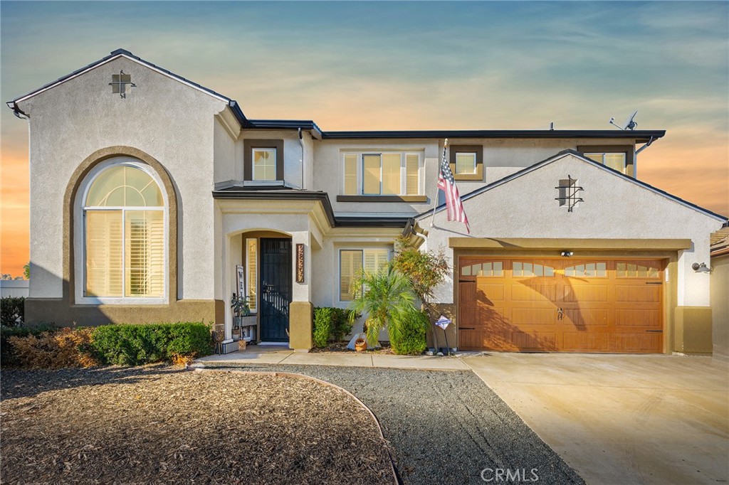 This Murrieta pool home located in The Golf Club at Rancho California Community sits on an expansive 11,000+ square foot lot in a desirable cul-de-sac location and features fully paid-off Tesla solar roof tiles for energy-efficient living and no HOA fees. The thoughtfully designed 4-bedroom, 3-bathroom floor plan offers main-level convenience with a guest bedroom and full bathroom downstairs, perfect for visitors or multi-generational living. The home showcases an open-concept family room seamlessly connected to the kitchen, complete with a charming fireplace for cozy gatherings, while the formal living room impresses with soaring vaulted ceilings and flows into an elegant formal dining room ideal for entertaining. Upstairs, you'll discover a versatile loft space, two generous secondary bedrooms, and a luxurious master suite featuring a spa-like master bathroom and an exceptionally spacious walk-in closet. Step out onto the private deck off the master bedroom to enjoy breathtaking views and peaceful mornings. The backyard has a covered patio providing shade for outdoor dining, plus a pool and relaxing spa where you can unwind and enjoy the Southern California lifestyle year-round and no rear neighbors.