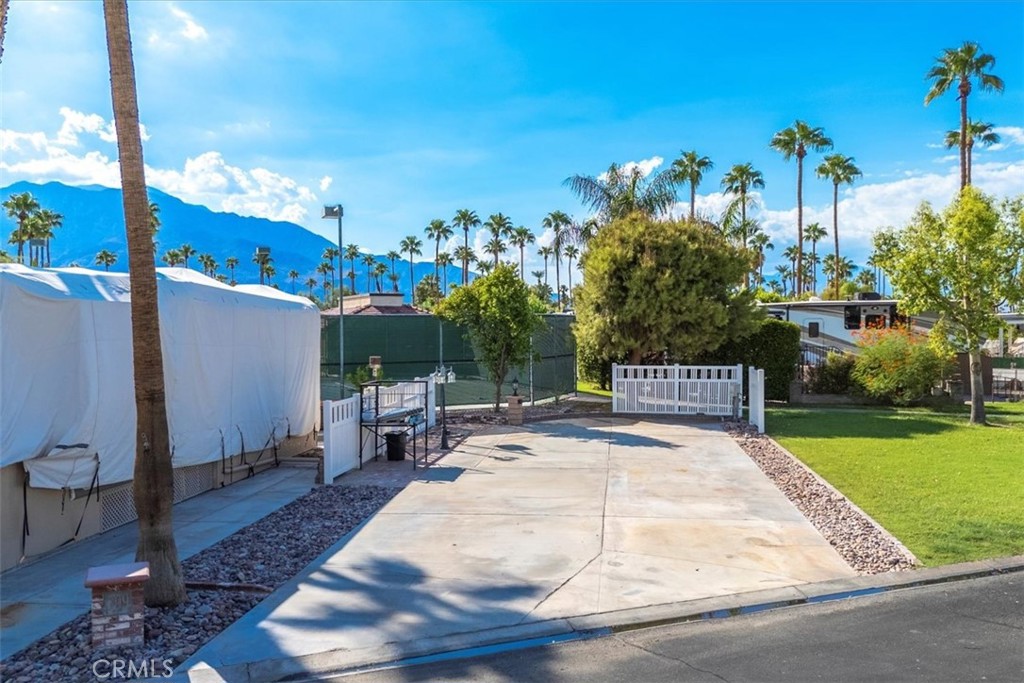 Prime Resort RV Lot with Mountain Views! Welcome to your perfect getaway at Outdoor Resorts Palm Springs, a prestigious Five Star Guard-Gated RV Resort. This updated corner lot offers privacy and charm with vinyl fencing, a stately palm tree, and decorative rock landscaping. Enjoy peaceful surroundings on a quiet street just steps from Satellite C. From your lot, take in panoramic views of the stunning San Jacinto Mountains—the perfect backdrop for your morning coffee or evening sunset. The HOA Lot Inspection is complete and cleared — it is move in ready!
Beyond the lot itself, the resort lifestyle is second to none. Spanning 137 acres of beautifully landscaped grounds, Outdoor Resorts Palm Springs combines luxury and affordability with endless amenities: 27 holes of executive golf, 10 tennis courts & 13 pickleball courts, 8 sparkling swimming pools, fully equipped fitness center, sports bar, on-site salon & barber shop, Full-service restaurant, 2 clubhouses with activities, events & entertainment.
Whether you’re looking for an active social scene or a relaxing retreat, Outdoor Resorts has it all. This is more than a lot—it’s a lifestyle!