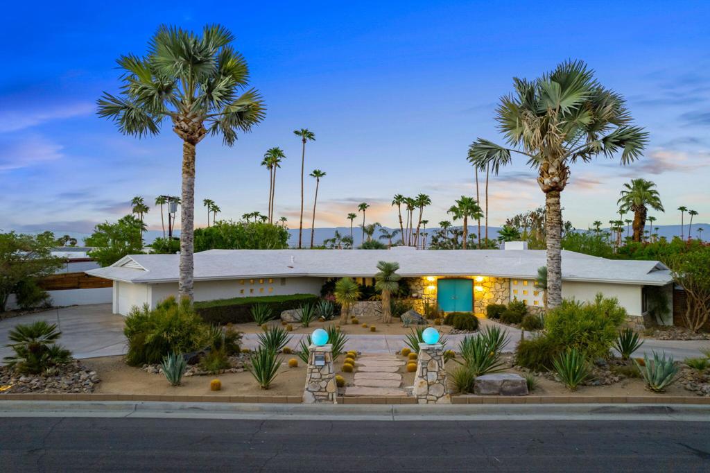 Discover The Pinkley House - An Icon of Mid-Century Design, Reimagined for Today. In the heart of South Palm Desert, just moments from El Paseo's high-end dining, shopping, and entertainment, sits a meticulously restored mid-century modern estate of rare significance. Designed in 1961 by renowned architect John Outcault for celebrated author and newspaperman Virgil Pinkley, this 3,696 sq ft residence, affectionately known as The Pinkley House, is both a preserved architectural treasure and a refined modern home. Set on over half an acre, the 4-bedroom, 3-bath property has undergone a complete restoration, with updated systems throughout and every detail thoughtfully considered. The gourmet chef's kitchen features custom walnut cabinetry, commercial-grade appliances, a breakfast nook, breakfast bar, and a generous passthrough from the formal dining room, ideal for entertaining. The expansive primary suite boasts a newly redesigned walk-in closet, exceptional scale, and direct access to private patios. One of the guest baths retains its original 1960's tile, expertly restored as a nod to the home's heritage. The living and dining areas are anchored by soaring redwood ceilings and a striking native stone fireplace. Multiple doors connect the interiors to secluded courtyards and lush patios, creating a seamless indoor-outdoor flow. The north-facing back of the home is a wall of glass the entire length of the house, framing views of the resort-style backyard with mature landscaping, landscape lighting, and the LED-lit saltwater pool. Outdoors, enjoy multiple entertaining spaces including an outdoor kitchen, fire pit seating area, outdoor shower, and the pool with removable safety fence and gate. Native stone accents on the exterior and the original front door with period hardware further honor the home's mid-century roots. Featured on Modernism Week's Signature Home Tour in 2018, The Pinkley House is a rare opportunity to own a celebrated piece of Palm Desert's architectural history, lovingly restored for the next generation.
