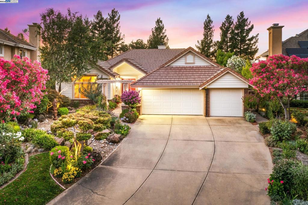 Located in the Ruby Hill gated community, this EAST FACING home offers refined living with convenient access to top rated schools, parks, and nearby amenities. This 4 bedroom, 2.5 bath home welcomes you with beautifully maintained landscaping inviting curb appeal, and a spacious 3 car garage. Inside, enjoy a formal living room with a fireplace, a dining room, a cozy family room with a second fireplace. The kitchen is the heart of the home, featuring quartz countertops, stainless steel appliances, warm wood cabinets, and a breakfast island with built in wine shelves, perfect for everyday meals and entertaining. The primary bedroom offers direct access to the backyard and features a spa like bathroom with a quartz finished stall shower, a luxurious soaking tub, and dual sinks. Step outside to a beautifully landscaped backyard sanctuary, complete with well maintained plants, blooming flowers, a serene garden perfect for relaxing or entertaining.