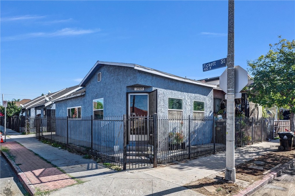 Great property, 5 separate units with tons of potential! 4 units are residential units- all 3 bedrooms, 2 bath units. The 5th unit is a commercial space, currently being used as a Zumba and smoothie shop. One residential unit is vacant and recently renovated, perfect opportunity to get a high paying tenant in. All units have a backyard space, parking space, laundry and their own utility meters. This property has great potential for developers, easy access to freeways, close to downtown. Check it out today!