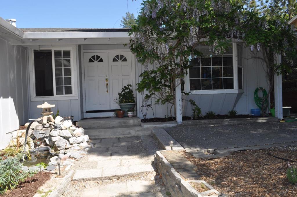 Come home to the fresh air of the Santa Cruz Mountains, yet close to Silicon Valley & minutes to the beach. wonderful & well maintained 4 bedroom 3 full bath plus a separate office or perhaps a nursery. 2 masters, views of the mountains, large oversized lot. Extremely private! Dual pane windows, bay living room window, green house window in the kitchen. Vaulted ceiling in the living room. Soak in your hot tub under the gazebo Great entertaining property!! wired for surround sound. No Sign until Tuesday.