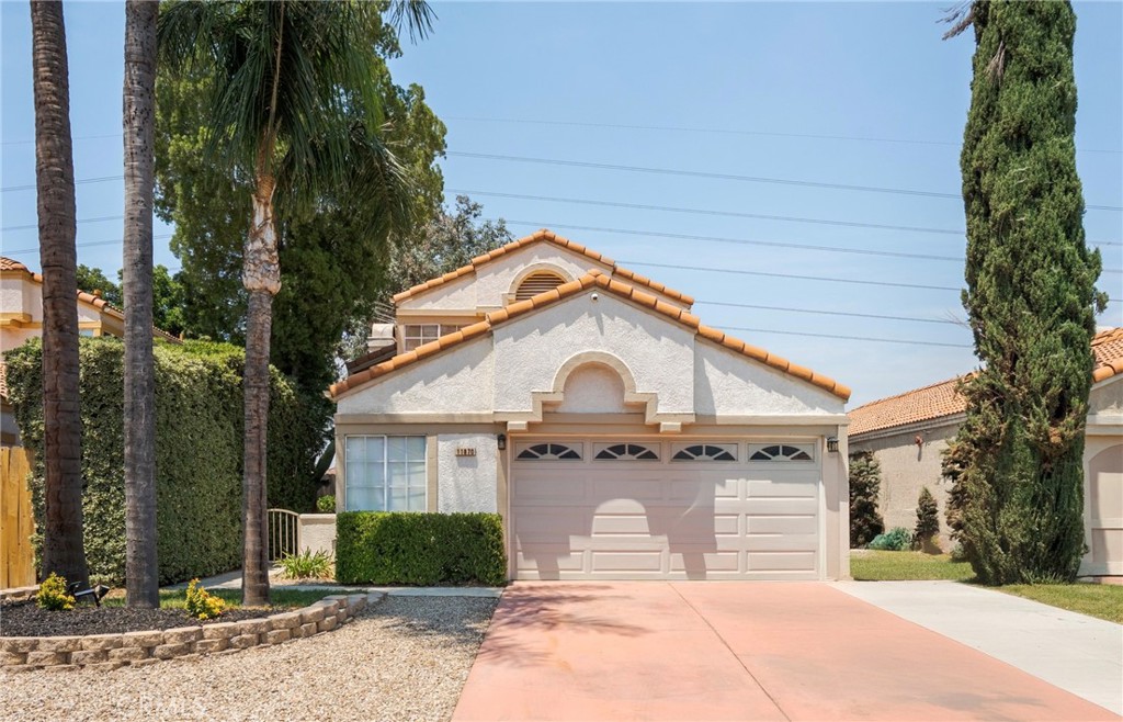 Nestled at the end of a cul-de-sac in the desirable Southridge neighborhood of Fontana, this inviting 3-bedroom, 2.5-bathroom home offers comfort, privacy, and scenic views. As you step inside, you’ll be greeted by vaulted ceilings and a spacious open-concept living area that flows seamlessly into the dining room and kitchen. An additional den on the main floor provides a flexible space. Ideal for a home office, playroom, or whatever suits your needs. Upstairs, the primary suite features an en-suite bathroom with a skylight that fills the space with natural light. Step out onto the recently updated private patio deck—perfect for enjoying your morning coffee or unwinding while watching the sunset. Two additional bedrooms and a full bathroom with a tub complete the upper level. This home backs onto a greenbelt, offering added privacy with no rear neighbors. The backyard includes a covered patio and a low-maintenance yard—great for entertaining or relaxing outdoors. Conveniently located near major freeways and just a short drive from Ontario Mills, Victoria Gardens, Ontario International Airport, and more. Don't miss the opportunity to make Pertila Place your new home.