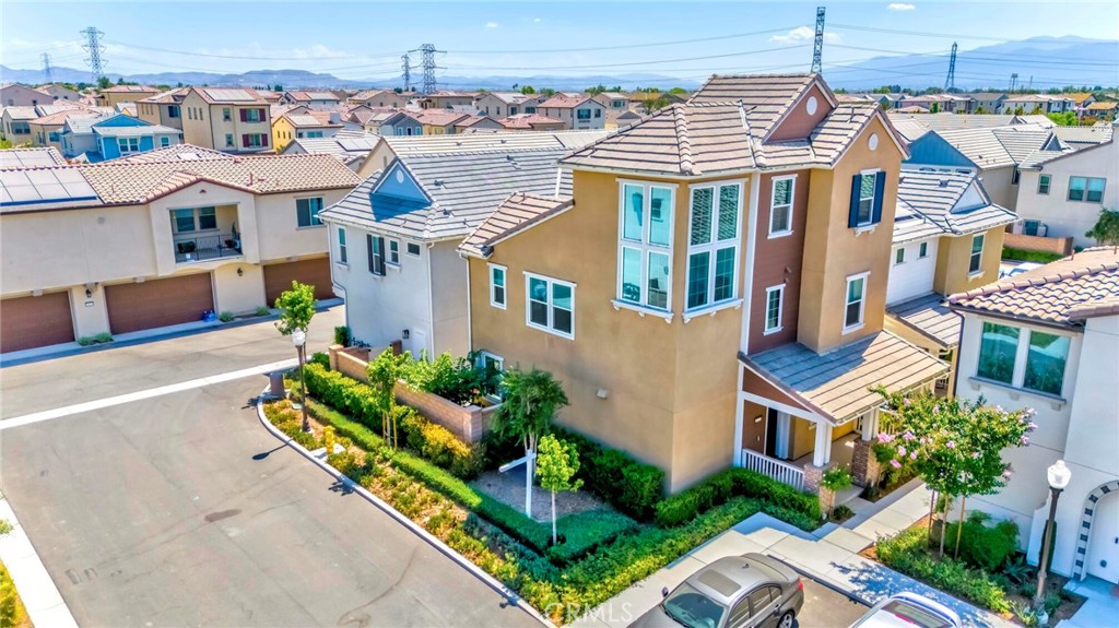 Welcome to 16145 Sandpiper Avenue in the Prestigious City of Chino! Discover this exceptional end unit residence located in the highly sought after community of The Preserve. This beautiful and spacious home features 4 bedrooms and 4 bathrooms across approximately 2,080 square feet of beautifully designed living space. The entry level offers a private den/office that can easily be used as a 5th bedroom perfect for multigenerational living, guests, or a private office setup. There is also a full bath on the main floor. Along with a huge open concept, showcases an expansive great room filled with natural light, upgraded flooring. The open dining area flows seamlessly into the remodeled kitchen, complete with granite countertops, a central island, stainless steel appliances, a walk-in pantry, and elegant cabinetry. Sliding door access to backyard w/direct access through the yard to the detached 2 car garage. The second floor is dedicated to the peaceful primary suite, featuring a spacious walk-in closet and a luxurious ensuite bathroom with dual sinks and a large walk-in shower. Two additional jack & jill bedrooms with ample closet space share a full bathroom with a shower over tub combination. A practical laundry area completes this level. On the top floor you have a huge open concept bedroom with tons of windows and an ensuite bath. Located next to ample guest parking on a cozy cul de sac. Luxury resort style Community amenities include exclusive access to multiple clubhouses such as The Parkhouse, Meadowhouse, and Gardenhouse, each offering an array of modern comforts. Residents enjoy sparkling swimming pools and spas, fully equipped fitness centers, sports courts including tennis and pickleball, children’s play areas, and beautifully landscaped gathering spaces designed for relaxation and entertainment. The community garden with fruit trees, grapevines, and a Harvest Club provides a farm-to-table experience for all ages. Additional highlights include a library, business center, event rooms, outdoor fireplaces, picnic lawns, and dog parks. With its unmatched amenities and vibrant lifestyle offerings, The Preserve delivers a true resort-style living experience in the heart of Chino.