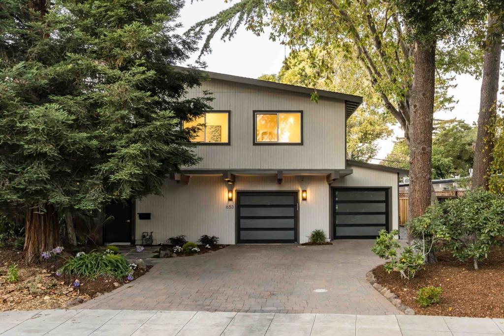 Set on nearly a quarter acre, this expanded and updated mid-century modern home offers more than 3,600 square feet of living space. Vaulted paneled ceilings, walls of glass, and distinctive architectural character speak to the home's original era, while thoughtful upgrades like oak floors and a modern kitchen with high-end Dacor appliances bring it into the present. The bright, open layout creates easy flow between the living room, dining area, and kitchen, with natural light pouring in from multiple angles. With six bedrooms, including a spacious and private primary suite, plus two dedicated offices, the home provides exceptional flexibility for families, guests, or working from home. The backyard is ideal for both entertaining and unwinding, complete with a large patio and sports court. All of this just minutes from University Avenue, with parks, commute options, and top-rated schools like Duveneck Elementary and Palo Alto High nearby (buyer to verify eligibility).