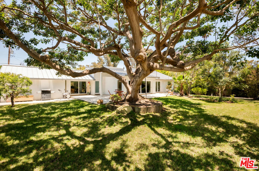 On Point Dume, steps away from the beach, a residence envisioned by world-renowned architect Michael Palladino was created. This breathtaking home is a work of art designed with a deep love of the beach, pristine coves, local foothills, generational trees, and the spirit of the land. The property exudes understated elegance and a mesmerizing indoor-outdoor flow. Seamlessly, it blends in with the grounds designed by landscape architect Pamela Burton. Entering the home, one is immediately drawn to the wall-to-wall pocket slider in the great room, the elegant quarter-sawn white oak floors, and the high ceilings. The abundant use of natural light allows for bright, open spaces throughout. A gourmet kitchen completed by Bulthaup with Gaggenau and Miele appliances, as well as radiant heated floors both inside and outside the home. Entire water purification system, room for pool, guest house, and additions. Includes coveted beach key to Little Dume beach, within walking distance to shops, market, and restaurants.