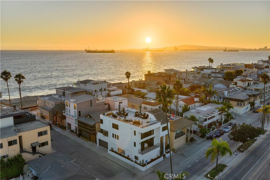 6824 E. Ocean is more than a residence-it’s a statement of lifestyle & elegance. Set on the prestigious Peninsula, this contemporary estate embodies modern architecture & the timeless allure of coastal living. Perfectly positioned, it showcases sweeping views of the ocean, bay, mountains, & beyond. Every detail reflects sophistication, offering not just a home, but an unparalleled experience. Set across 4 levels, this estate has been completely reimagined with designer upgrades & finishes. The 1st level, with direct entry from the 4-car garage, includes a spacious bedroom, a fully remodeled bath, & a generous great room with kitchenette-ideal for guests, a family lounge, or secondary living quarters. The main living & entertaining level is designed to capture the surrounding beauty. Floor-to-ceiling windows fill the fireside living room with natural light, while a balcony frames bay views. The dining area features a custom dry bar w/wine fridge, & the gourmet kitchen is a showpiece w/ a suite of sleek new Café appliances, new quartz countertops, and new refaced cabinets. A 2nd balcony brings in ocean breezes, and a spiral staircase provides convenient access to the 3rd level. The 2nd level also offers a bedroom, complete with new bath. The primary retreat encompasses the entire 3rd level-a serene sanctuary with bay views, versatile office space, conversation room, laundry nook, & new spa-like bath with dual vanities, designer fixtures, soaking tub beneath a statement chandelier, an oversized walk-in shower, and walk-in closet. The show stopping 4th floor roof top deck is an outdoor haven designed for both relaxation & entertaining. Thoughtfully outfitted with brand-new designer furnishings (all included), this space is ready to enjoy. Take in panoramic views, bask in the sun from multiple lounging areas, and gather at the bar for unforgettable sunset sips. Additional highlights: 9” luxury vinyl flooring throughout, elevator service to 3 levels, fresh paint, new tankless water heater, and more. (Refer to supplements for list.) 10/10 location in one of the most coveted stretches of the coast, where opportunities are exceedingly rare. Here, every day invites a new adventure-paddleboarding, sailing from the Yacht Club, kayaking through the canals, or cruising on a Duffy. Stroll to the vibrant shops & dining of Belmont Shore, or embrace miles of bike paths & the boardwalk just outside your door. This estate is the ultimate expression of coastal luxury!