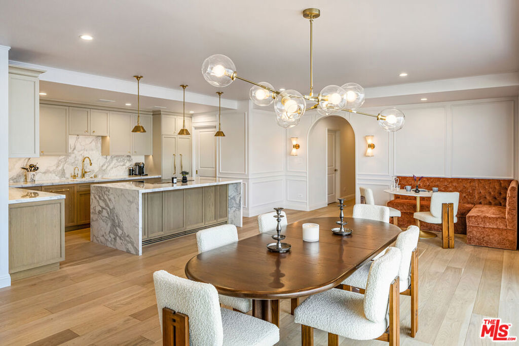 This truly exceptional, one-of-a-kind north-facing residence is now available for lease, fully furnished, at the highly desirable Doheny Plaza, which is ideally situated where Beverly Hills meets West Hollywood. This remarkable unit has been recently and meticulously remodeled to offer the spacious look and feel of a single-family home. The custom finishes and fixtures throughout beautifully combine classic elegance with sophisticated contemporary design. The luxury residence also boasts stunning panoramic views of the city and mountains to the north, west, and east. With its rare and exceptionally spacious layout of over 3,000 square feet, the turn-key unit features an open floor plan that has been expertly designed for comfortable living and effortless entertaining. A substantial terrace extends across all public rooms, perfectly blending indoor and outdoor lifestyles. The stunning marble-clad kitchen features a walk-in pantry and flows seamlessly into the picturesque breakfast banquette, elegant dining area and intimate living room. A separate large family room with a magnificent built-in bar and stylish powder room add to its overall appeal. Features such as custom cabinetry and lighting, arched doorways, architectural moldings and hardwood floors add warmth and elegance. The oversized primary suite is a true sanctuary, boasting a spa-like bathroom with walk-in shower, steam room, a tub and heated floors plus a showroom-quality dressing room. Two additional bedrooms each feature their own custom bathrooms, offering comfort and privacy for guests or family. Storage throughout the unit is ample. Full-service building amenities include valet, concierge, a state-of-the-art fitness center and pool. The location is unbeatable on the border of Beverly Hills and minutes from the Sunset Strip and some of LA's most exclusive social clubs - Soho House, San Vicente Bungalows and The Bird Streets Club.