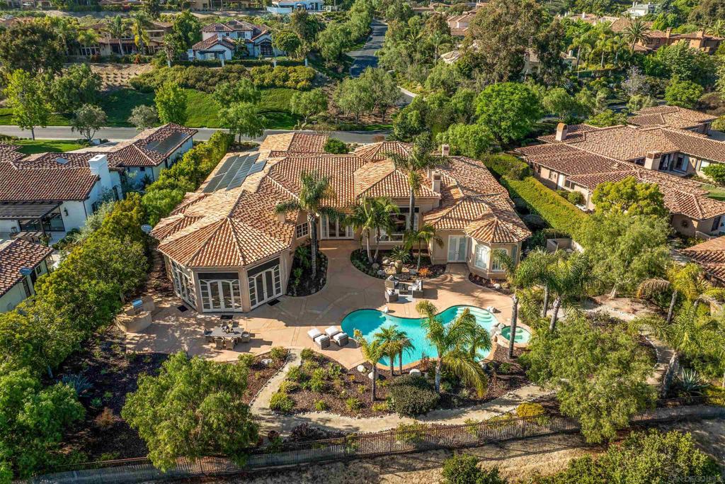 Now available for the first time, this exceptional estate in Rancho Pacifica represents the pinnacle of custom design and livable luxury. This is a rare opportunity to own one of Rancho Pacifica’s most distinguished single-level estates.Nestled behind the gates of this prestigious community, Rancho Verde Trail blends timeless architecture with modern luxury, crafted for those who value scale, serenity, and seamless indoor-outdoor living. Situated on a flat, south-facing lot with canyon preserve views, the home features soaring ceilings, formal and casual entertaining spaces, a chef’s kitchen, and 5 en-suite rooms with 2 custom offices -all on a single level with no interior stairs. Outside, resort-style grounds await with a sparkling pool, spa, and manicured gardens designed for both relaxation and celebration. With unmatched proximity to top-rated schools, private golf clubs, resort spas, equestrian centers, and Del Mar’s world-class dining and beaches, this home offers the ultimate combination of prestige, privacy, and practicality. Inquire now for private access. Homes of this caliber rarely come to market — and never last long.