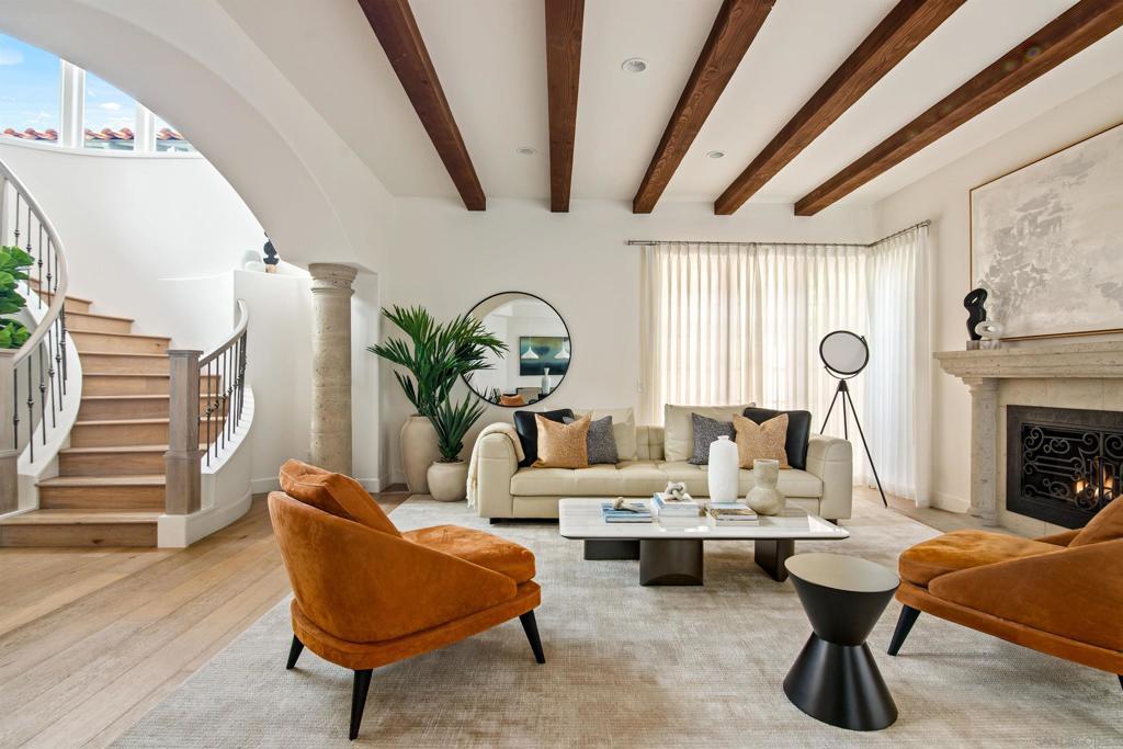 This stylish 3-bedroom, 2.5-bath townhome is located in the highly walkable and vibrant La Jolla Village neighborhood, just minutes from the beach, local dining, shops, and coastal trails. With thoughtfully designed interiors and high-end finishes throughout, the home offers an ideal setting for long-term stays in one of San Diego’s most desirable seaside communities. The main floor features an open-concept living space filled with natural light, a comfortable sectional sofa, a fireplace, and curated artwork that adds a warm, contemporary touch. The adjacent dining area leads into a sleek, modern kitchen with marble countertops, a center island, and premium appliances. French doors open to a private patio, perfect for relaxing or entertaining, with stylish outdoor furnishings and lush greenery providing a serene atmosphere. Upstairs, the primary suite offers a king bed, vaulted ceilings, a fireplace, a wall-mounted TV, and an ensuite spa-like bathroom with a soaking tub, dual vanities, and a walk-in shower. The second bedroom includes a queen bed, while the third bedroom features a full bunk bed and a cozy setup ideal for kids or visiting guests. A second full bathroom upstairs, and a powder room on the main level adds extra convenience. The home includes central air conditioning and heat, in-unit laundry, two garage parking spaces (with key access), and driveway parking. No pets are allowed. A 30-night minimum stay is required. Sleeping Accommodations (Maximum Occupancy 6): Bedroom 1 - 1 King bed - Bedroom 2 - 1 Queen bed - Bedroom 3 - 1 Bunk Bed - There are 2.5 bathrooms.