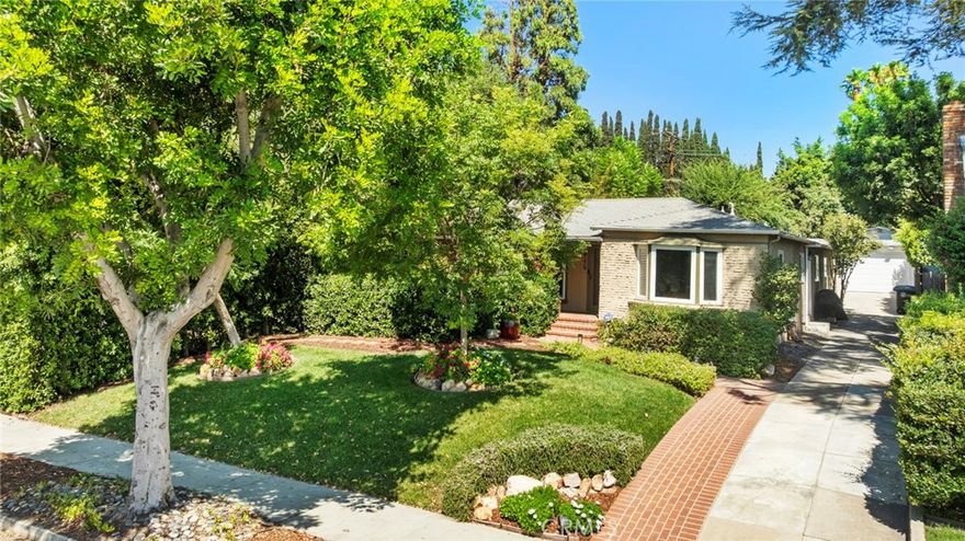 Absolutely Move-In Ready!  Welcome to this beautifully updated 3 bedroom 2 bath home with a guest house in Northwest Glendale. The home has a spacious porch and patio with a great sitting area. The formal living and dining area feature a unique fireplace with natural light, perfect for both relaxing and entertaining guests. The kitchen has been exquisitely remodeled with newer cabinets and granite counters, with a lovely breakfast nook. Both bathrooms have been tastefully remodeled.  Stunning master suite with hardwood floors, large bathroom, great closet space, and office or gym space. The backyard is an entertainer’s paradise—perfect for all types of guests, with a covered patio with fruit trees that leads to a guest house with a full bath. Additional highlights include a detached garage—ideal for parking or a potential ADU conversion.
