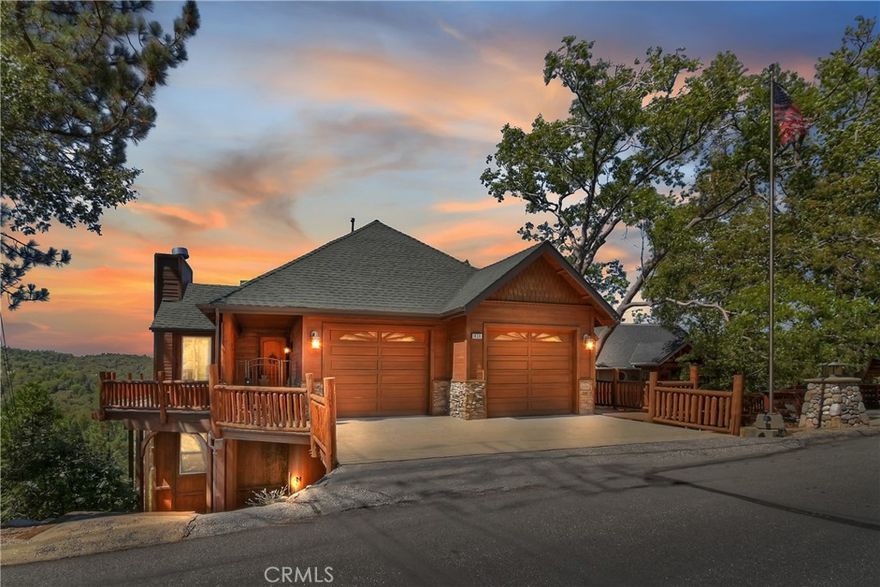 What You See: A seamless blend of indoor comfort and outdoor beauty—warm firelight, soft evening breezes, and a veranda where the sunset paints every gathering in gold. This is where dinner parties turn into unforgettable nights .This custom residence features high end finishes and design elements including soaring ceilings, large windows and glass doors allowing for an abundance of natural light, beautiful wood accents while encompassing over 3000 sq feet of gracious living space. The home exudes elegance and provides the ultimate venue for indoor/outdoor living and entertaining. As you enter the gated courtyard you feel a sense of beauty and warmth and are mesmerized by the stunning views. The primary suite comes with fireplace and has Primary bathroom with jetted tub and shower. Sliders leading to a balcony overlooking mountain and city light views. There are an additional 2 bedrooms and private office and large laundry room. The 3rd hosts a second family room with fireplace and bar, pool table , sauna and steam shower, additional  room with fireplace. Large Deck with ping pong table and various gym equipment can be moved outside.  Large oversized 2 car garage which enters into the kitchen.  You are close to Tavern Bay and many hiking trails. The house is in Arrowhead Woods which gives you Lake Rights.